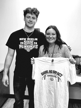 Wilhite receives Make an Impact Award from former student