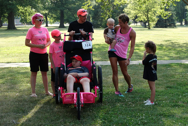 Rachel Antle, Central Illinois ambassador for Ainsley’s Angels, said they had four local members running with the Evans family throughout the 19-mile run into Jacksonville. The local chapter met them in Arenzville and ran with them to Crazy Horse Campgrounds, where the family stayed for the evening.  She explained to the group that, “this year Simon has decided to run a 5K every five days with his dad and brother.” He ended up running even more that day in Jacksonville. 