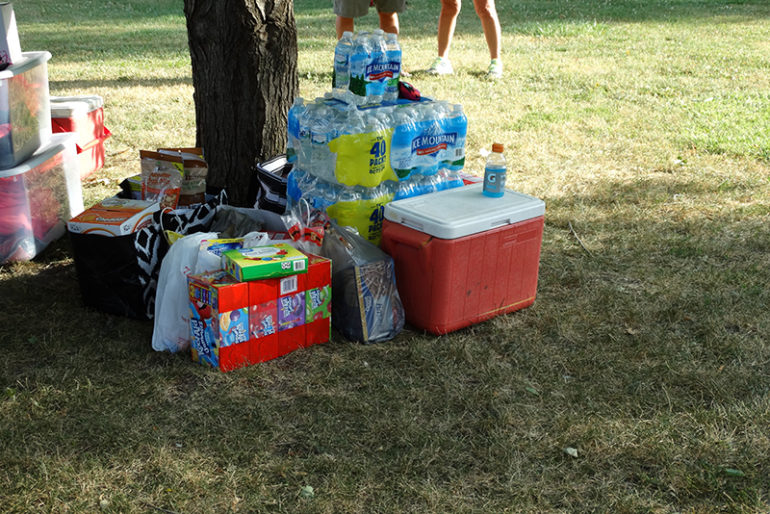 The Evans met with other Ainsley’s Angels supporters in Community Park around 6 p.m., had refreshments and presented the Evans family with donated supplies to keep the family going, including bottled water (Shaun, the father, goes through many bottles each day on their trek), snacks, toys and more.