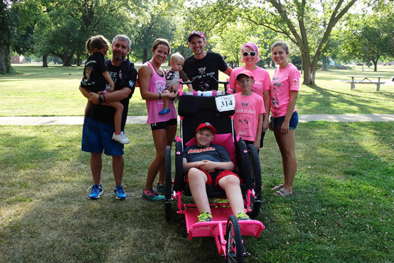 The Evans met with other Ainsley’s Angels supporters in Community Park around 6 p.m., had refreshments and presented the Evans family with donated supplies to keep the family going, including bottled water (Shaun, the father, goes through many bottles each day on their trek), snacks, toys and more.