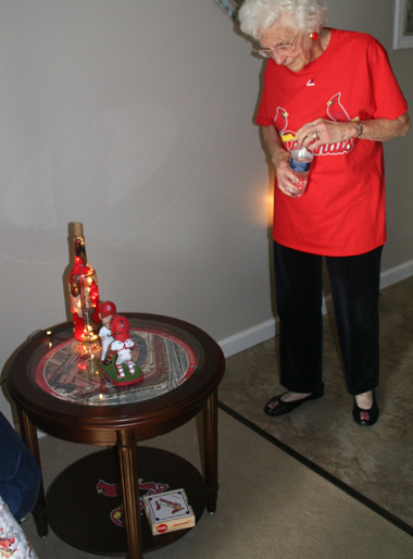 Helens table with Busch Stadium and a Cardinal winebottle light