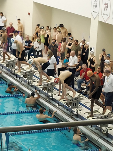 Colin Wilson, in lane 7 with the red cap, getting ready to start one of his races the 2022 Illinois State YMCA Swimming Championships.