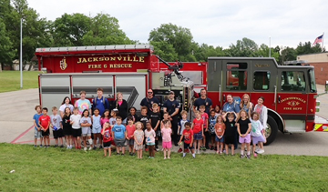 City firefighters visit YMCA camp